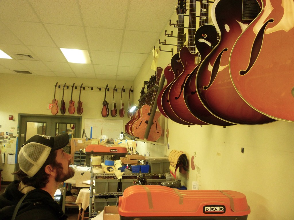in awe of the guitar wall